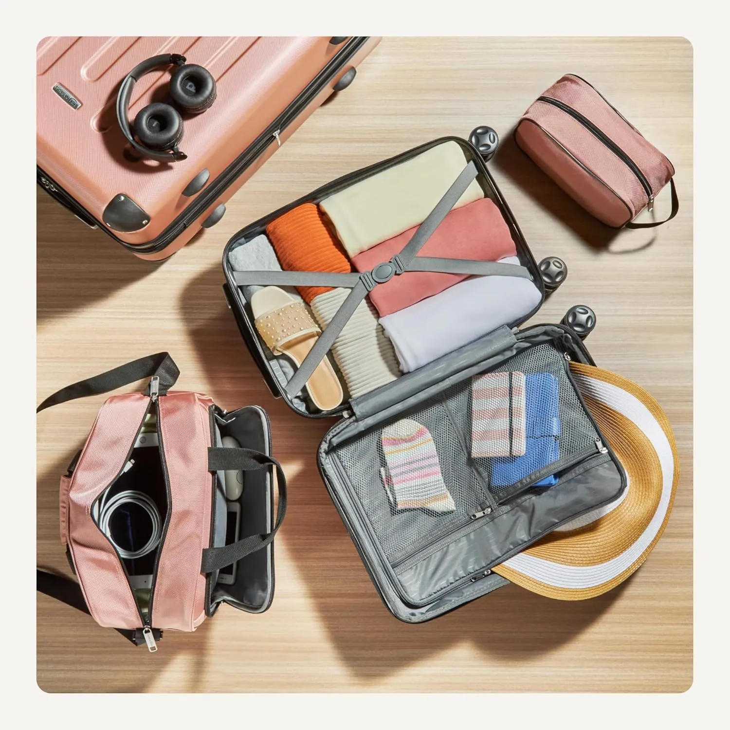 Amazon Basics 4-Piece Luggage Set, Including Two Hardside Suitcases With Multi-directional Spinner Wheels (22" Carry-On and 28" Checked), 15" Tote Bag and 10" Compact Travel Bag, Rose Gold
